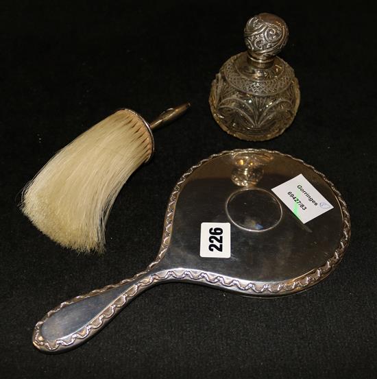 Silver back mirror, clothes brush and silver topped bottle